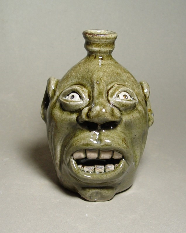 Face Jug: Local stoneware clay, kaolin details, alkaline glaze, wood-fired